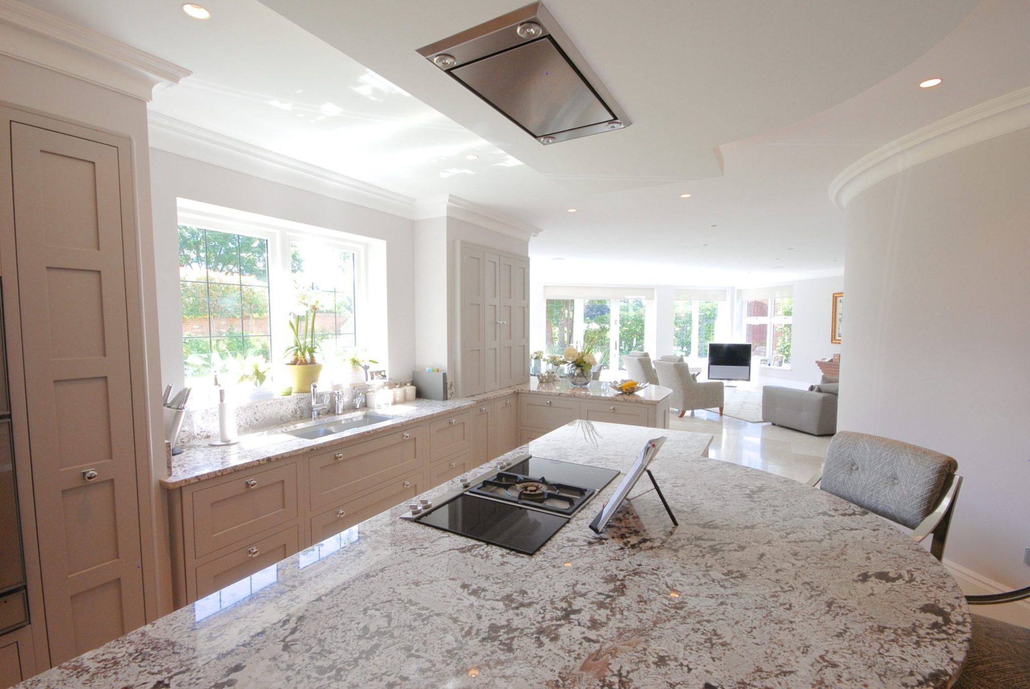 a kitchen with a stove top oven sitting next to a window.